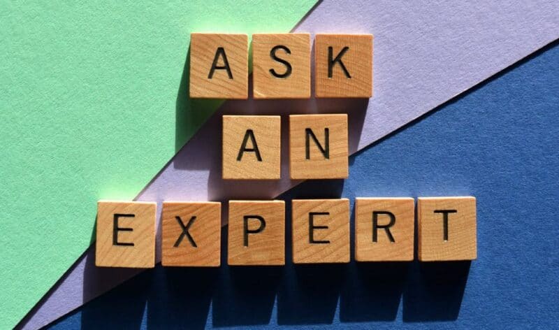 Wood blocks spell out "Ask an Expert" on a colorful background.