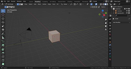 The modeling workspace in Blender with a 3D viewport, properties panel and outliner. 
