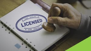 A book with the word "license" is stamped with Envato Elements colors.