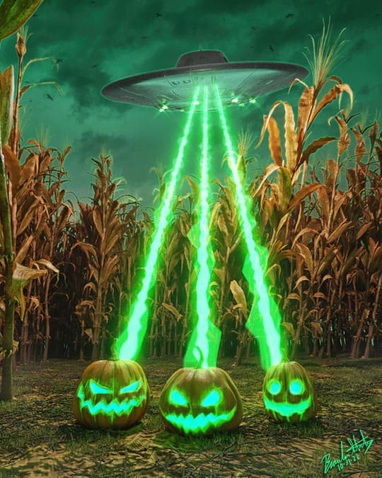 A UFO shoots green lasers at three pumpkins in a cornfield.